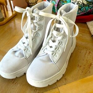 Dr.Marten white on white boots. Small stain that can be removed on left shoe.